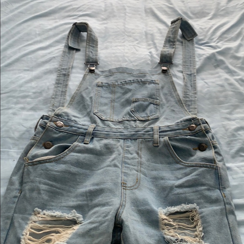 Ripped denim overalls
